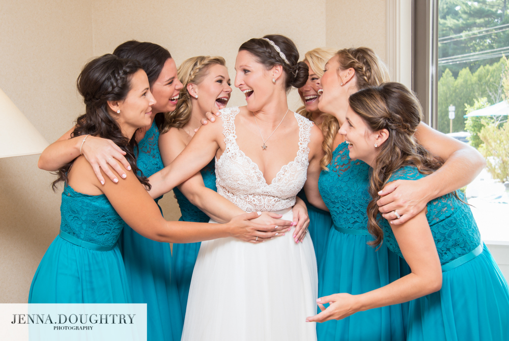 Maine Wedding Photographer bride bridesmaids group hug
