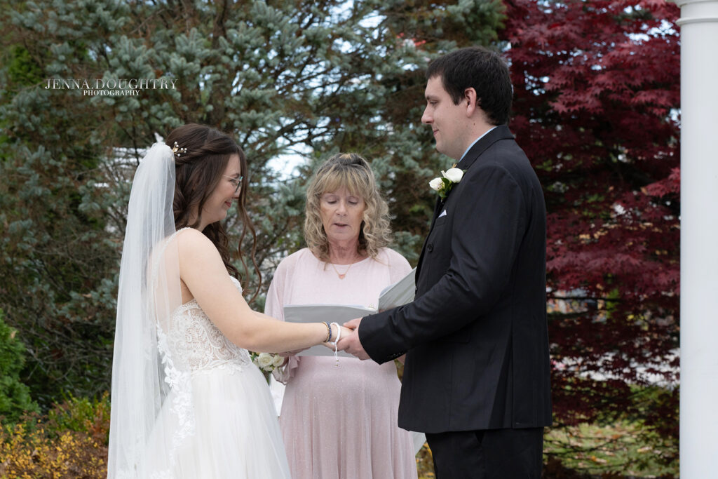 Bride and groom exchange vows at wedding ceremony
