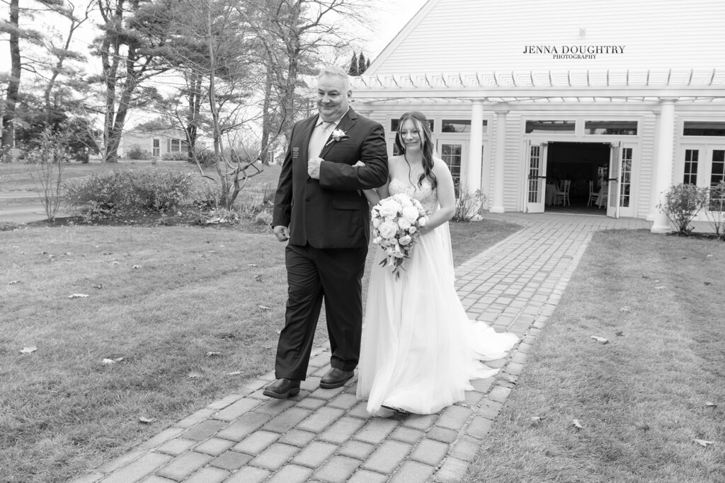 Bride walking down the aisle with her father at Village By The Sea wells Maine